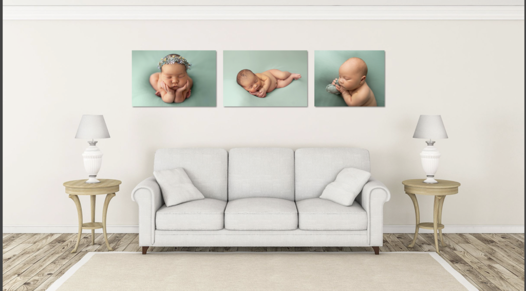 Newborn wall art displayed above a living room couch