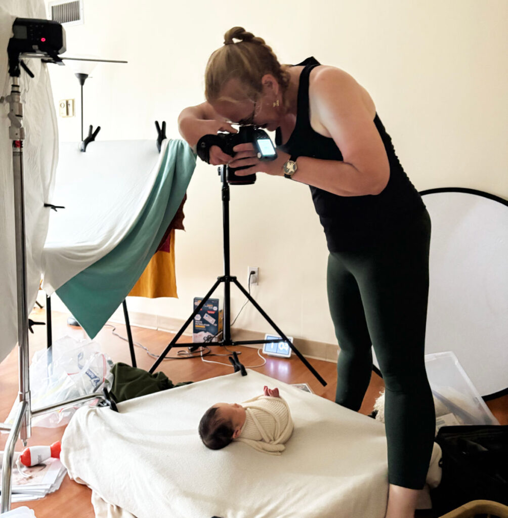 Photographer Laura Pineda photographing a newborn portrait session at Alternate Angles Photography