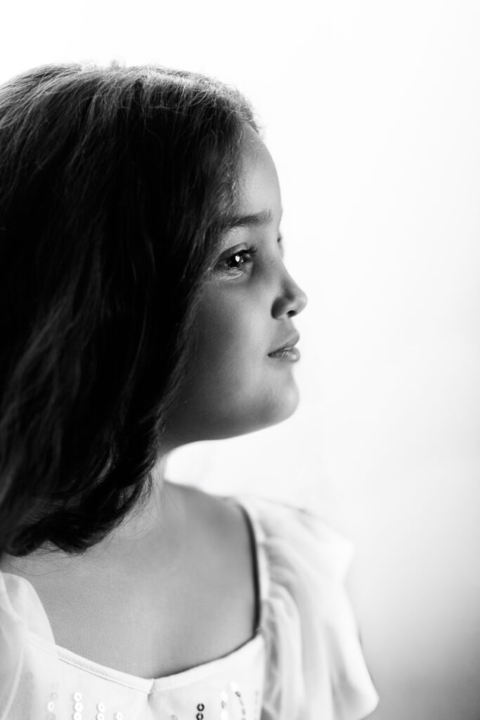 Black and white side profile portrait of a 6 year old girl during a fine art child photography session