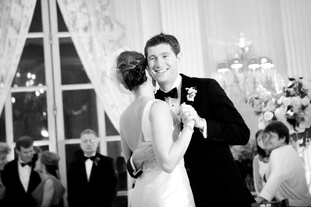 Bride and groom sharing their first dance during a wedding reception at Rosecliff Mansion in Newport Rhode Island